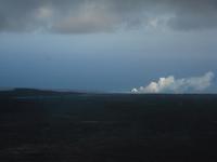 The lava flows into the ocean - you can see the steam